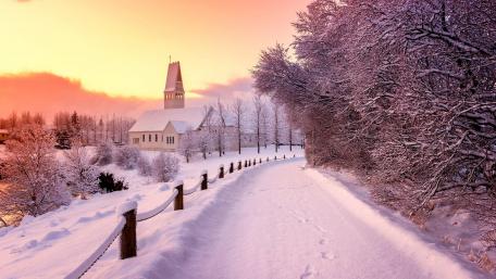 Enchanting Winter Village Scene with Snowy Landscape wallpaper