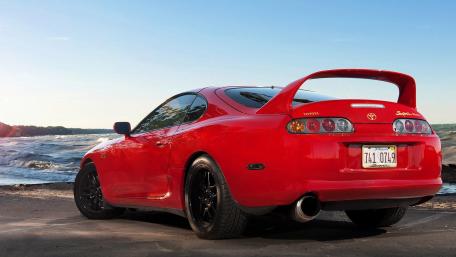 Red Toyota Supra Parked by the Beach wallpaper