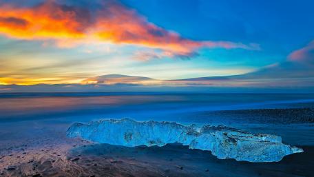 Serene Arctic Sunset Over Calm Waters wallpaper