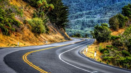 Winding Road Through Nature's Beauty wallpaper