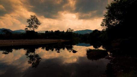 A Mysterious Sunset over a River wallpaper