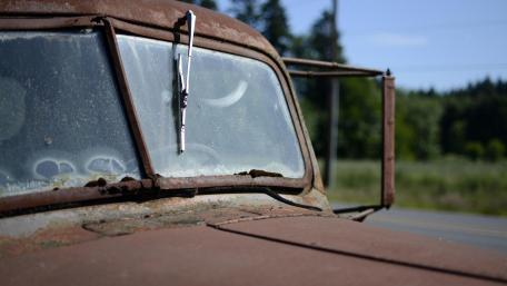 Rusty Beauty of an Abandoned Wrecked Car Wallpaper wallpaper
