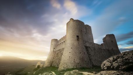 Majestic Castle Ruins Under a Dramatic Sky wallpaper