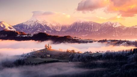 Serene Mountain Village in Winter Foggy Landscape wallpaper