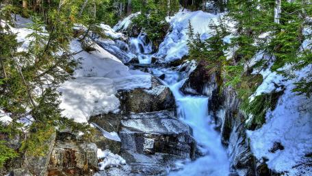 Serene Winter Waterfall Scene wallpaper