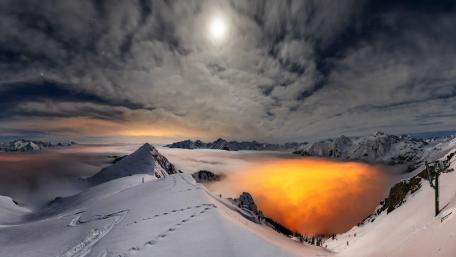 Majestic Winter Summit Under an Enigmatic Sky wallpaper
