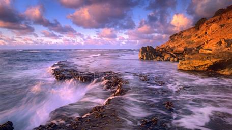 Serene Sunset Over Coastal Waves wallpaper
