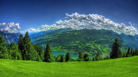 Breathtaking Highland Landscape with Majestic Mountains and Sky wallpaper