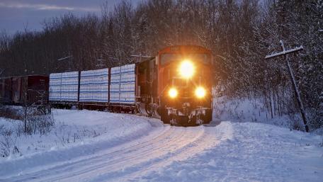Winter Train Journey Through Snowy Landscape wallpaper