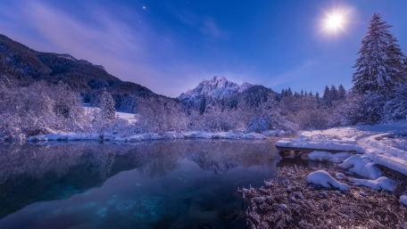 Serene Winter Reflection in a Mountain Lake wallpaper