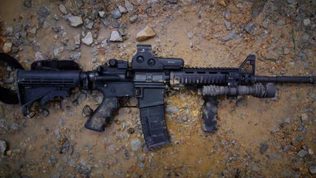 Assault Rifle on Rocky Terrain wallpaper