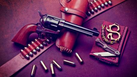 Vintage Revolver and Ammunition Showcase wallpaper