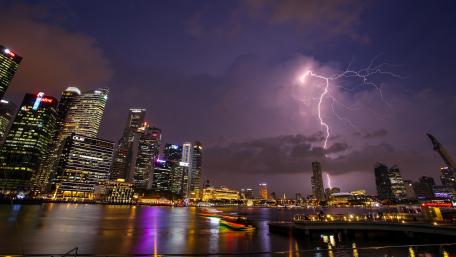 Dramatic Lightning Over a Cityscape Night Scene wallpaper