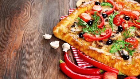 Delicious Sicilian Pizza with Fresh Vegetables and Spices wallpaper