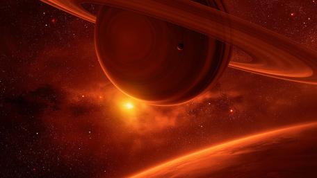 Majestic Ringed Planet in Cosmic Red Glow wallpaper