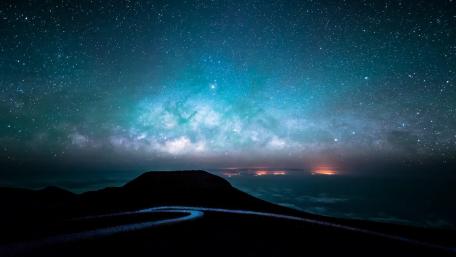 Cosmic Serenity Over a Mountain Ridge wallpaper