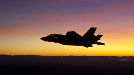 Jet Silhouette Against Dawn Sky wallpaper