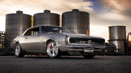 Classic Silver Chevrolet Camaro Under Sunset Sky wallpaper