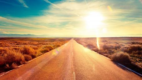 Endless Road Under a Radiant Sky wallpaper