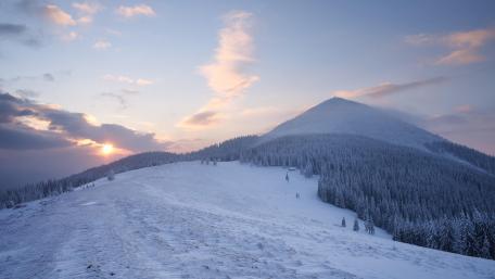 Dawn in the snowy mountains wallpaper