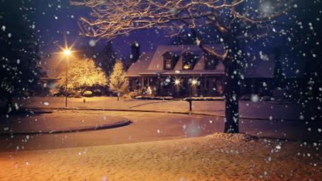 Winter's Embrace on Snowy Evening Street wallpaper