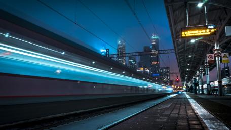 Vibrant Night at a Modern Train Station wallpaper