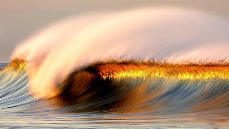 Golden Waves of the Ocean Dance in the Light wallpaper