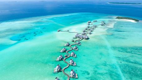Overwater Bungalows in Pristine Turquoise Waters wallpaper