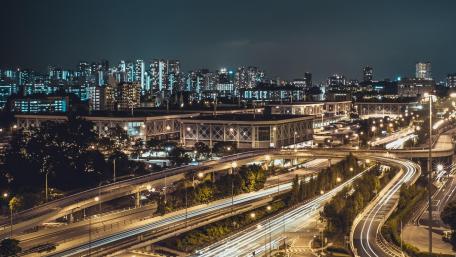 Urban Nightscape with Light Trails and Metropolis Skyline wallpaper