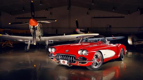 Classic Red Chevrolet Corvette in Vintage Hangar wallpaper