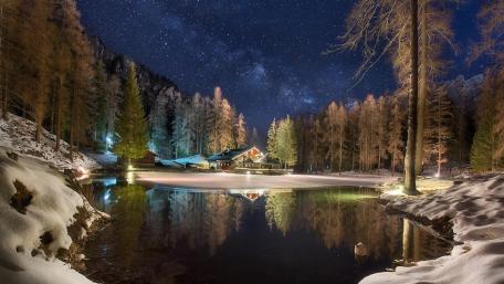 Winter Night Sky Over a Tranquil Lake wallpaper