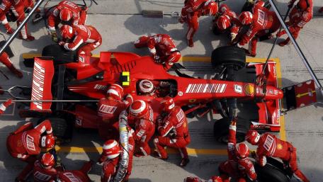 Precision Pit Stop in Formula One Racing wallpaper
