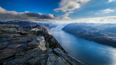 Majestic Fjord Landscape Under a Blue Sky wallpaper
