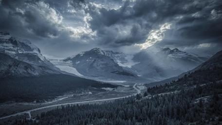 Majestic Mountains Under Dramatic Skies wallpaper