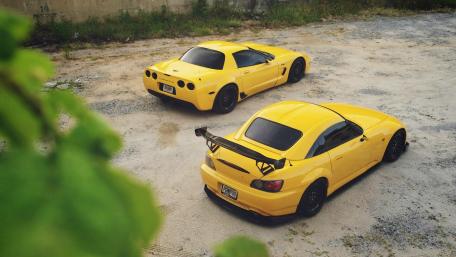 Vibrant Yellow Sports Cars in Action wallpaper