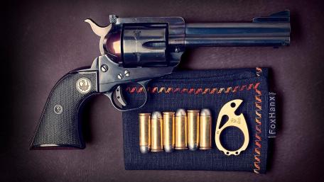 Revolver and Ammunition on Display wallpaper