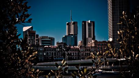 Urban Skyline Under Clear Blue Sky wallpaper