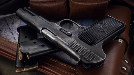Vintage Handgun with Leather Holster Display wallpaper
