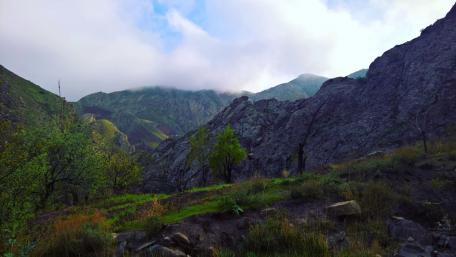 Majestic Mountain Landscape Under Cloudy Skies wallpaper