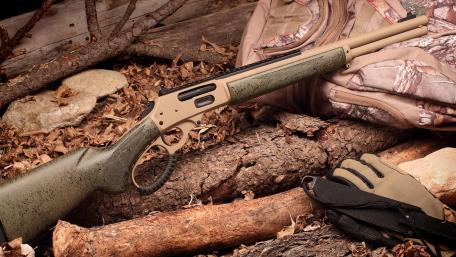 Winchester Rifle on Forest Floor Display wallpaper