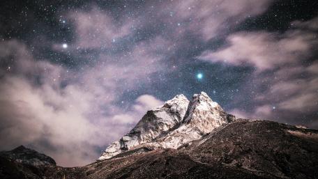 Majestic Peaks Beneath a Starry Sky wallpaper