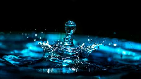 Mystical Water Drop in Blue Light wallpaper