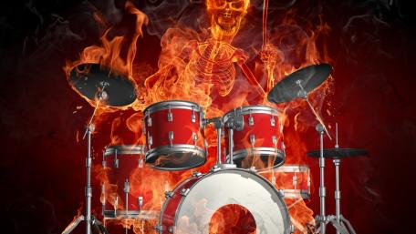 Drums and a skeleton of a man burn in flames wallpaper