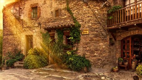 Charming Old Town Facade with Lush Greenery wallpaper