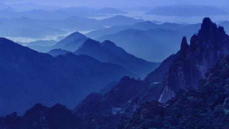 Majestic Mountain Ranges in Blue Tranquility wallpaper