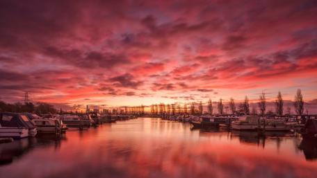 Stunning Dawn Reflections Over Serene Waterway wallpaper