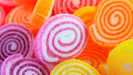 Sweet Spiral Delight: A Colorful Candy Extravaganza wallpaper