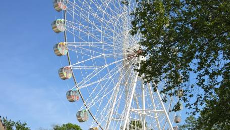 Whimsical Views of a Ferris Wheel in the City wallpaper