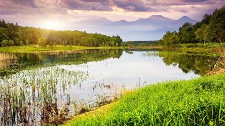Serene Reflection Over a Tranquil Lake Scene wallpaper
