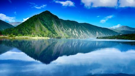 Serene Mountain Reflection under Blue Sky wallpaper